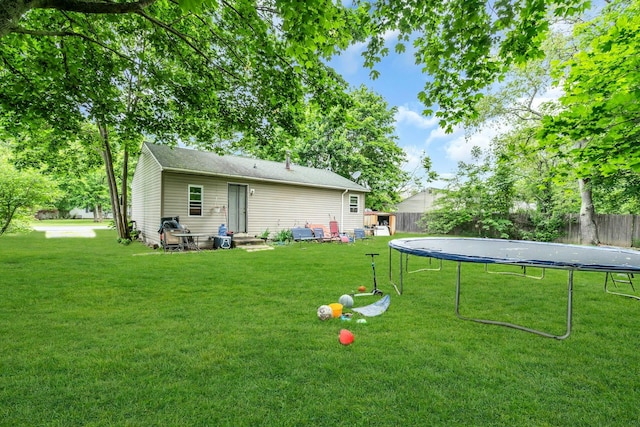 625 Scherger Ave, East Patchogue, NY 11772 - view of yard featuring a trampoline and entry steps