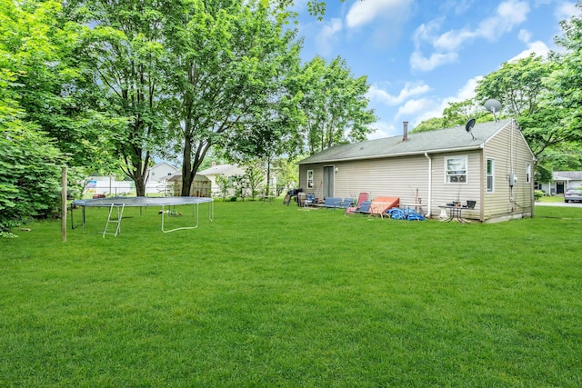 625 Scherger Ave, East Patchogue, NY 11772 - view of green lawn with a trampoline