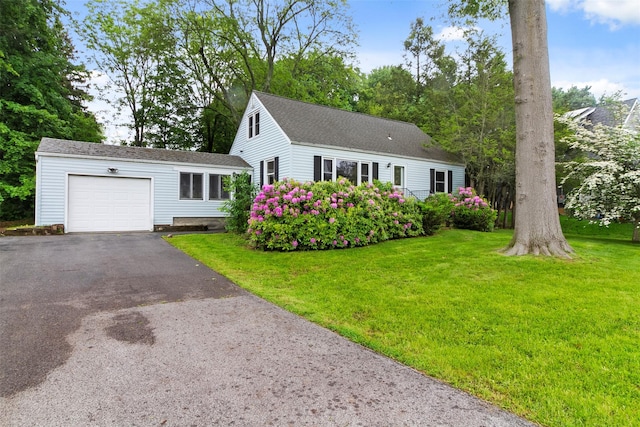21 Patricia Ave, Fishkill, NY 12524 - view of front facade featuring an attached garage, asphalt driveway, a front yard, and roof with shingles