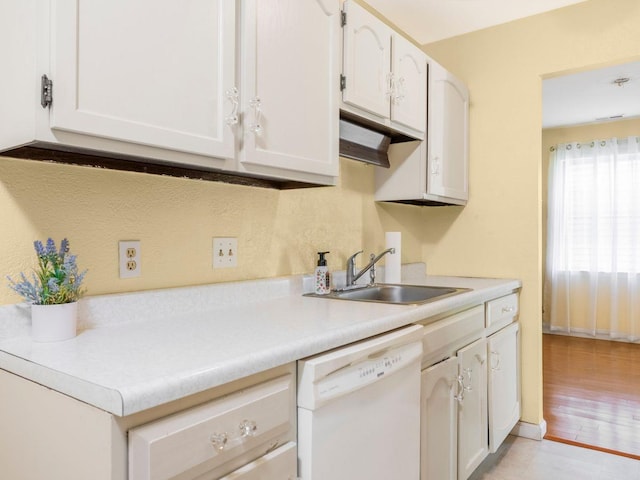902 Commons Way Unit B, Fishkill, NY 12524 - kitchen featuring white dishwasher, a sink, light countertops, and white cabinetry