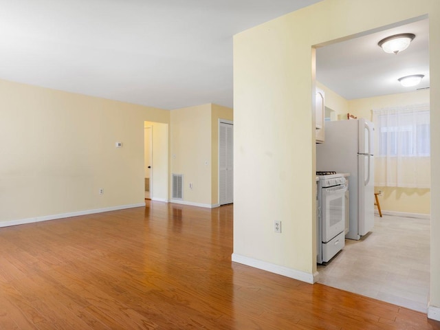 902 Commons Way Unit B, Fishkill, NY 12524 - kitchen featuring white appliances, light wood finished floors, and baseboards