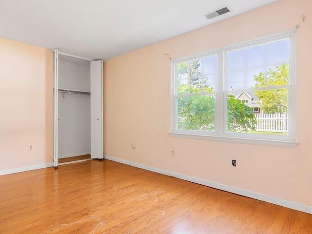 902 Commons Way Unit B, Fishkill, NY 12524 - unfurnished bedroom featuring light wood-style floors, baseboards, and a closet