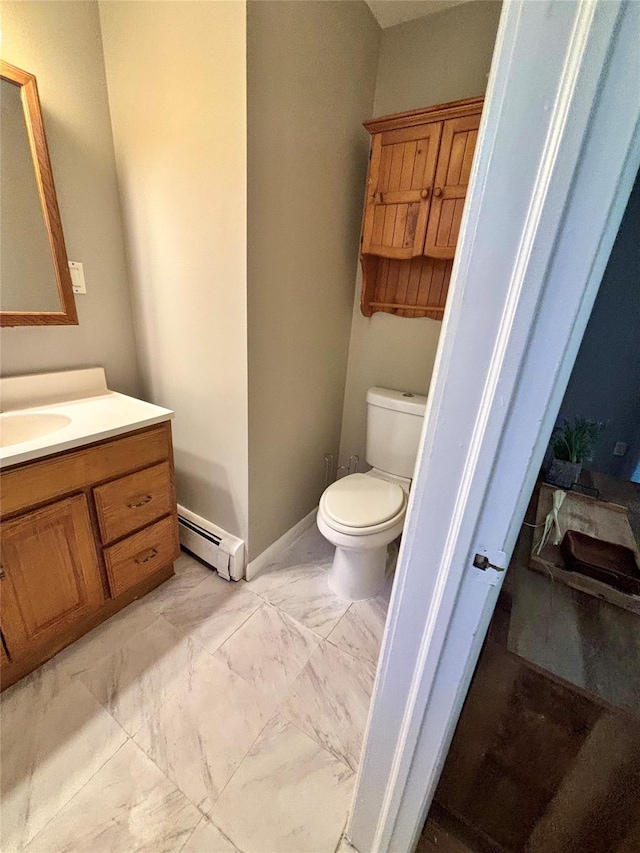 49 N Chestnut St, Beacon, NY 12508 - bathroom with a baseboard heating unit, vanity, and marble look tile flooring
