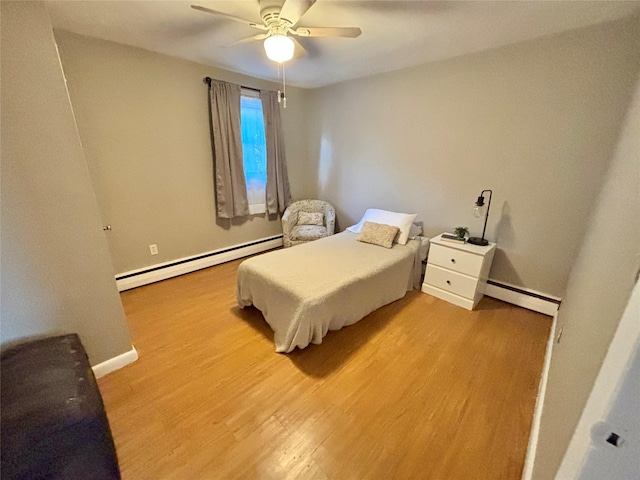 49 N Chestnut St, Beacon, NY 12508 - bedroom with baseboard heating, light wood finished floors, and ceiling fan