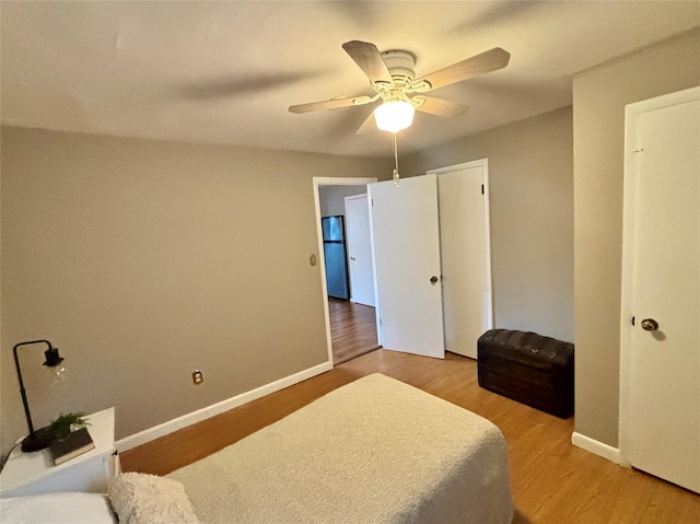 49 N Chestnut St, Beacon, NY 12508 - bedroom featuring light wood finished floors, freestanding refrigerator, and ceiling fan