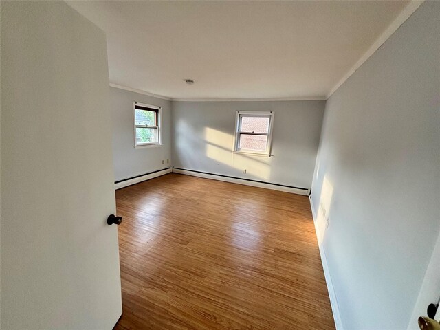 49 N Chestnut St, Beacon, NY 12508 - spare room with ornamental molding, wood finished floors, and baseboard heating