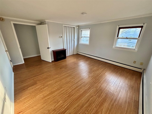 49 N Chestnut St, Beacon, NY 12508 - unfurnished bedroom featuring a baseboard radiator, light wood-style floors, and crown molding