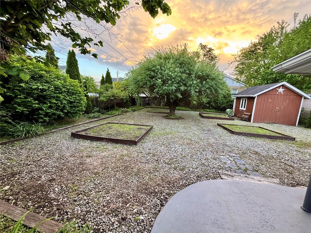 49 N Chestnut St, Beacon, NY 12508 - yard at dusk featuring a shed and a vegetable garden