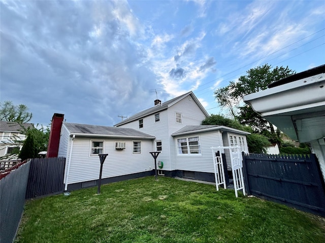 49 N Chestnut St, Beacon, NY 12508 - rear view of house with an AC wall unit and an outbuilding