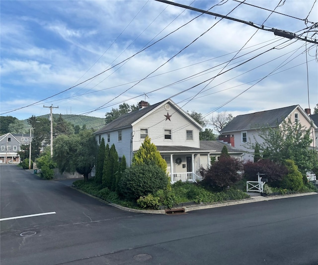 49 N Chestnut St, Beacon, NY 12508 - view of front of house with a chimney and a porch