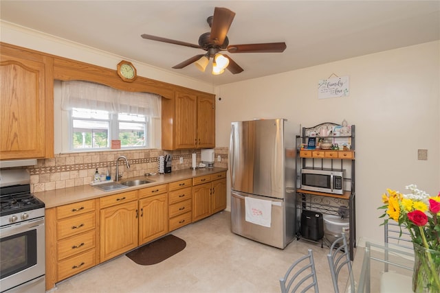 964 Pemart Ave, Peekskill, NY 10566 - kitchen featuring stainless steel appliances, a sink, backsplash, ceiling fan, and light countertops