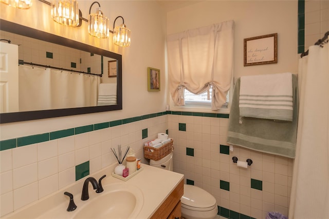 964 Pemart Ave, Peekskill, NY 10566 - bathroom featuring vanity, tile walls, toilet, a chandelier, and wainscoting