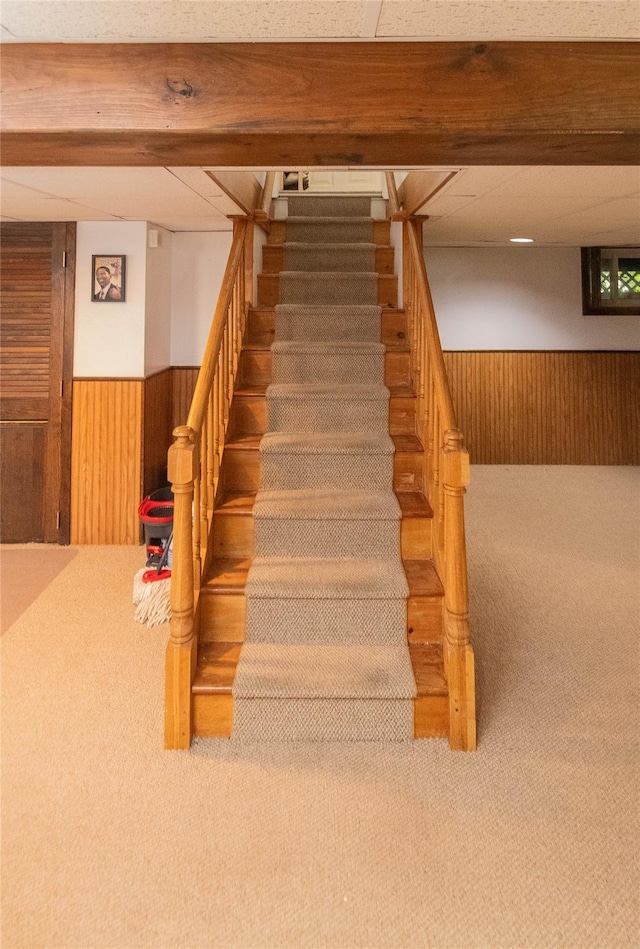 964 Pemart Ave, Peekskill, NY 10566 - staircase with carpet floors, wood walls, and wainscoting
