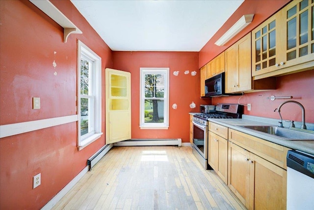 239-241 Hurleyville Main St, Hurleyville, NY 12747 - kitchen with stainless steel range with gas stovetop, a sink, black microwave, dishwasher, and glass insert cabinets