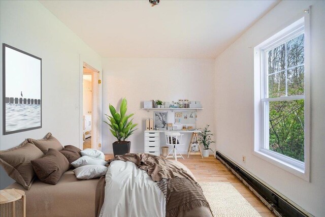 239-241 Hurleyville Main St, Hurleyville, NY 12747 - bedroom featuring a baseboard radiator and light wood finished floors