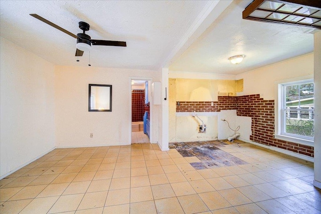 239-241 Hurleyville Main St, Hurleyville, NY 12747 - unfurnished living room featuring a ceiling fan, a textured ceiling, brick wall, and light tile patterned floors