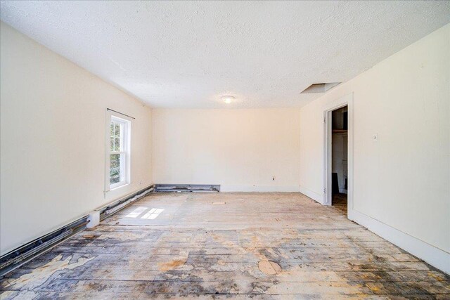 239-241 Hurleyville Main St, Hurleyville, NY 12747 - unfurnished room with a textured ceiling and baseboards