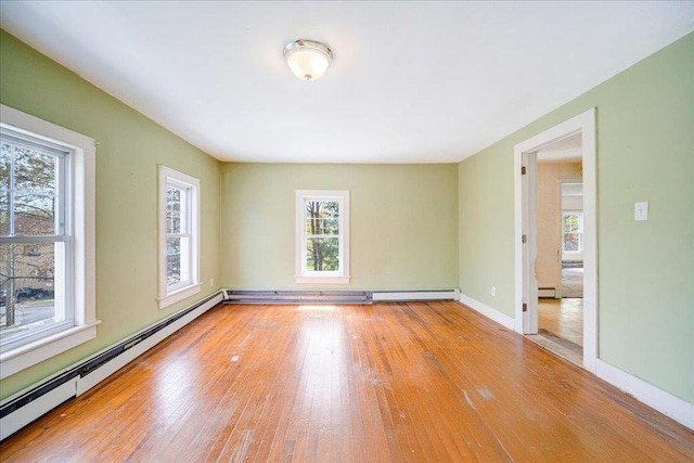 239-241 Hurleyville Main St, Hurleyville, NY 12747 - unfurnished room with a baseboard heating unit, wood-type flooring, baseboards, and a baseboard radiator