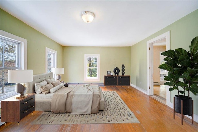 239-241 Hurleyville Main St, Hurleyville, NY 12747 - bedroom with multiple windows, wood finished floors, and baseboards