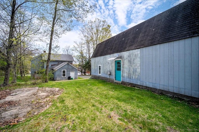 239-241 Hurleyville Main St, Hurleyville, NY 12747 - rear view of property featuring an outbuilding and a lawn