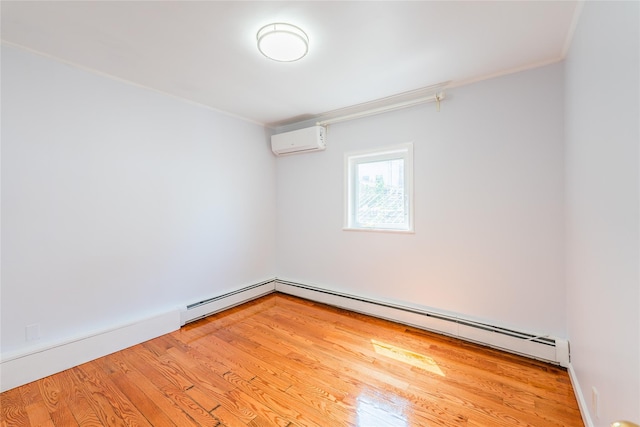 42-51247THST 247th St, Little Neck, NY 11363 - unfurnished room featuring a wall unit AC, crown molding, a baseboard heating unit, and light wood finished floors
