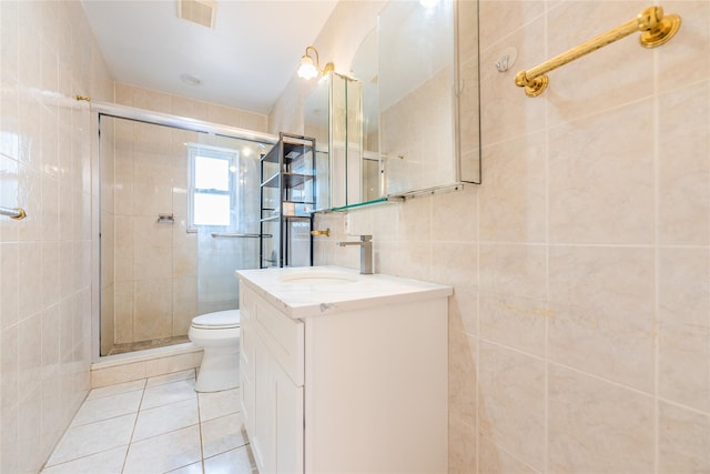 42-51247THST 247th St, Little Neck, NY 11363 - bathroom with tile patterned flooring, tile walls, toilet, vanity, and a stall shower