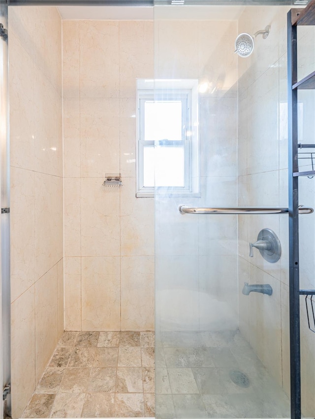 42-51247THST 247th St, Little Neck, NY 11363 - bathroom featuring tiled shower and stone finish floors