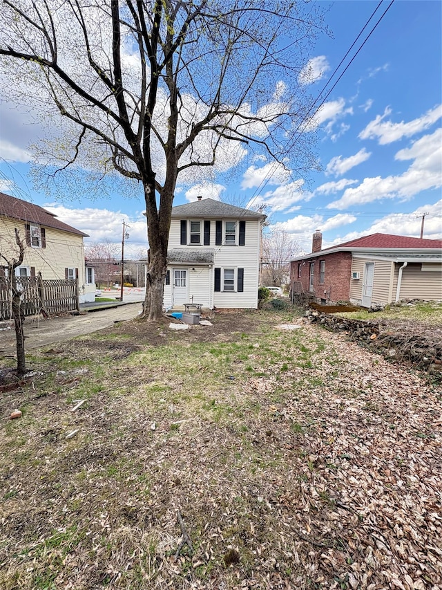 back of property with fence