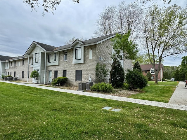 17 Cheyenne Ct Unit C17, Coram, NY 11727 - view of front of house featuring brick siding, central AC unit, and a front lawn