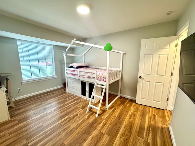 17 Cheyenne Ct Unit C17, Coram, NY 11727 - bedroom with wood finished floors and baseboards