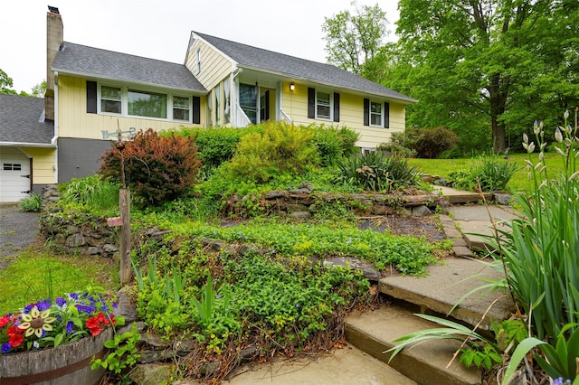 136 Foggintown Rd, Brewster, NY 10509 - view of front of property featuring a chimney, roof with shingles, and a garage