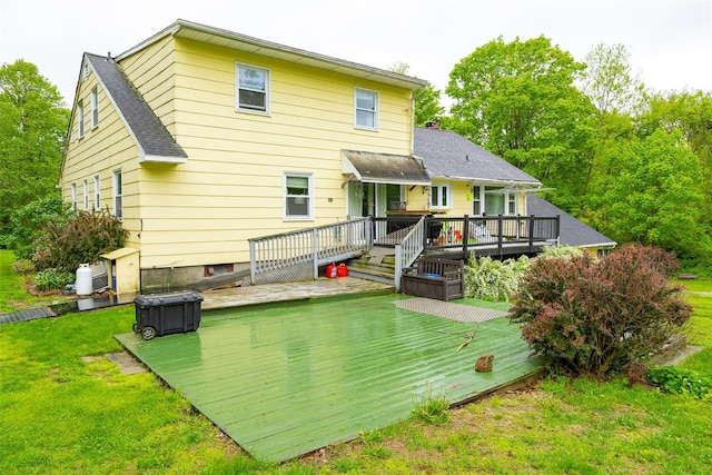 136 Foggintown Rd, Brewster, NY 10509 - rear view of house featuring a wooden deck, a lawn, and roof with shingles