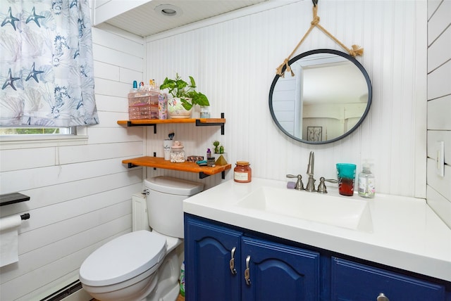 136 Foggintown Rd, Brewster, NY 10509 - half bath with toilet, vanity, and wooden walls