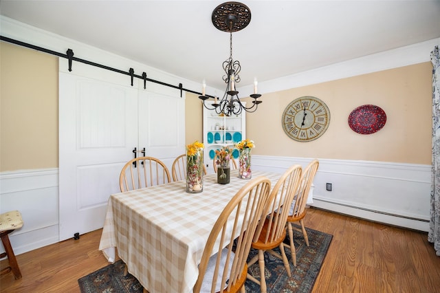 136 Foggintown Rd, Brewster, NY 10509 - dining room with a wainscoted wall, a baseboard heating unit, a barn door, a chandelier, and wood finished floors