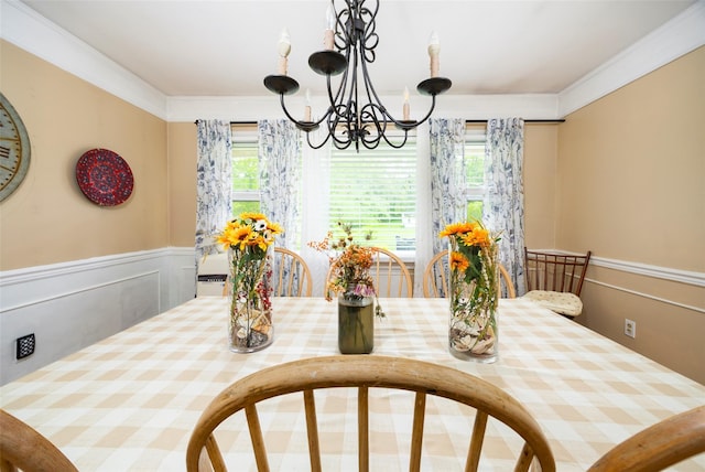 136 Foggintown Rd, Brewster, NY 10509 - dining space featuring a chandelier, a wainscoted wall, and ornamental molding
