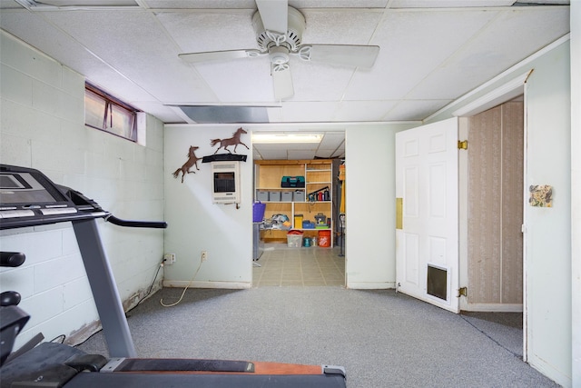 136 Foggintown Rd, Brewster, NY 10509 - exercise room with a drop ceiling, a ceiling fan, concrete block wall, carpet, and baseboards