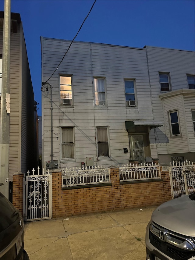 51-17 34th St, Long Island City, NY 11101 - view of front of house with a gate and cooling unit