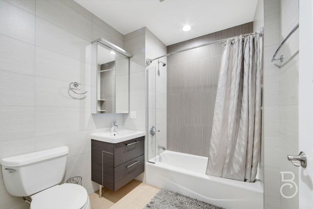 31-10 28th Rd Unit 1A, Astoria, NY 11102 - full bath featuring tile walls, shower / tub combo with curtain, vanity, and toilet