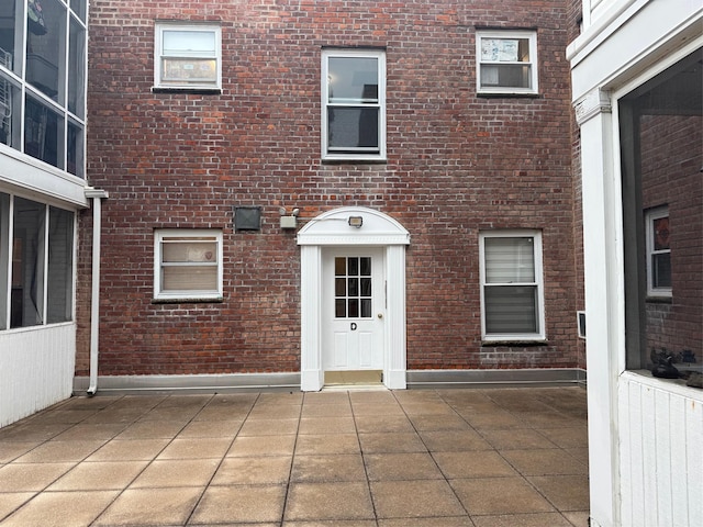 284 Central Ave Unit D-6, Lawrence, NY 11559 - view of exterior entry featuring brick siding