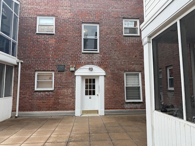 284 Central Ave Unit D-6, Lawrence, NY 11559 - view of exterior entry with brick siding