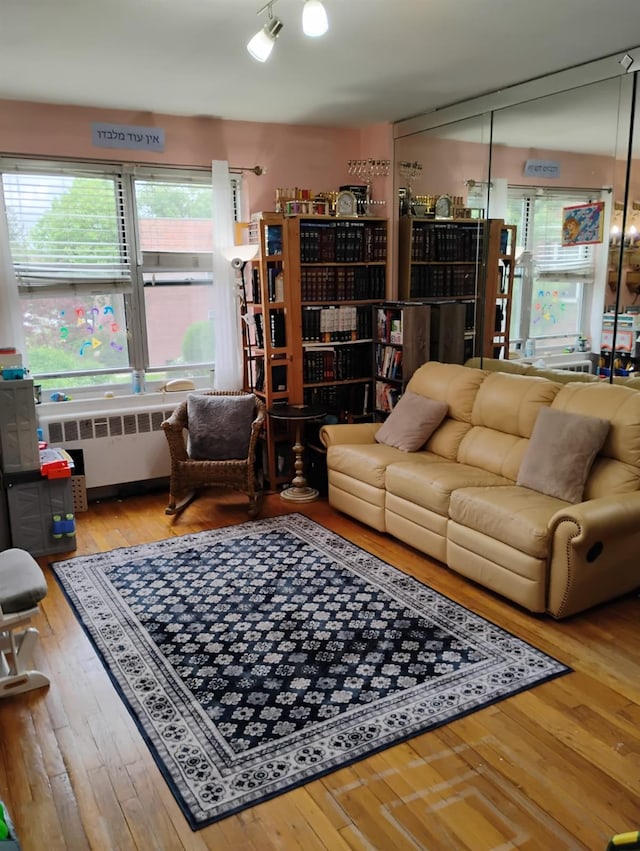 284 Central Ave Unit D-6, Lawrence, NY 11559 - living area featuring radiator and hardwood / wood-style floors