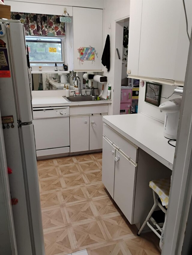 284 Central Ave Unit D-6, Lawrence, NY 11559 - kitchen featuring white appliances, a sink, light countertops, and white cabinets