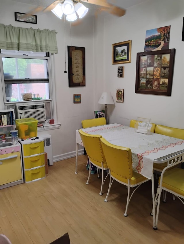 284 Central Ave Unit D-6, Lawrence, NY 11559 - dining space with a ceiling fan, light wood-type flooring, cooling unit, and baseboards