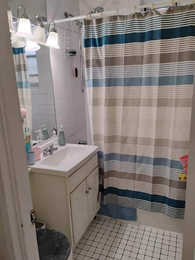 284 Central Ave Unit D-6, Lawrence, NY 11559 - bathroom featuring tile patterned flooring, vanity, and a shower with curtain