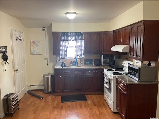 69 Myrtle Ave, Westbury, NY 11590 - kitchen featuring white electric stove, under cabinet range hood, a baseboard heating unit, a sink, and stainless steel microwave