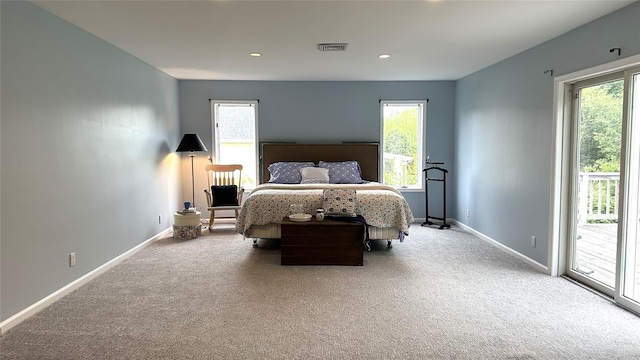 bedroom with access to outside, multiple windows, carpet, baseboards, and recessed lighting