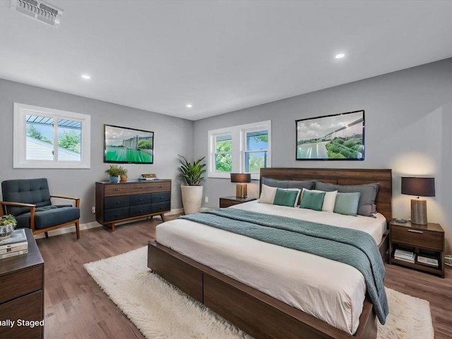 7 Pal Way, Plainview, NY 11803 - bedroom featuring multiple windows, wood finished floors, recessed lighting, and baseboards
