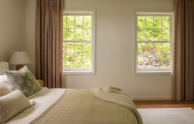 89 Stillerberg Strada, Kerhonkson, NY 12446 - bedroom with baseboards, wood finished floors, and multiple windows
