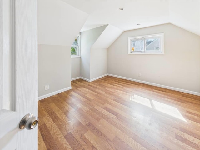 95 State Ave, Wyandanch, NY 11798 - additional living space featuring light wood-style floors, vaulted ceiling, and baseboards
