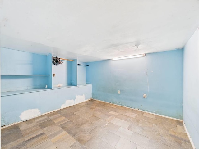 95 State Ave, Wyandanch, NY 11798 - empty room with stone finish floors
